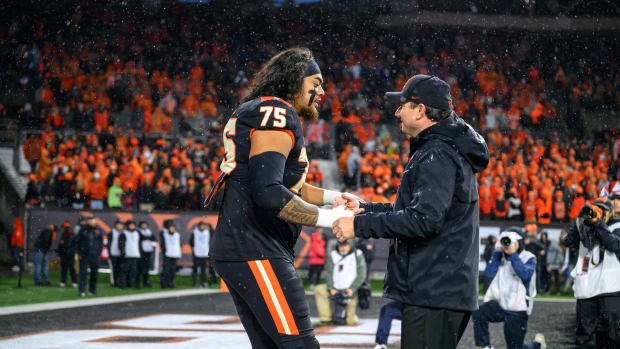 Nov 18, 2023; Corvallis, Oregon, USA; Oregon State Beavers head coach Jonathan Smith greets offensive lineman Taliese Fuaga (75) during senior ceremonies pregame against the Washington Huskies at Reser Stadium. Mandatory Credit: Craig Strobeck-USA TODAY Sports